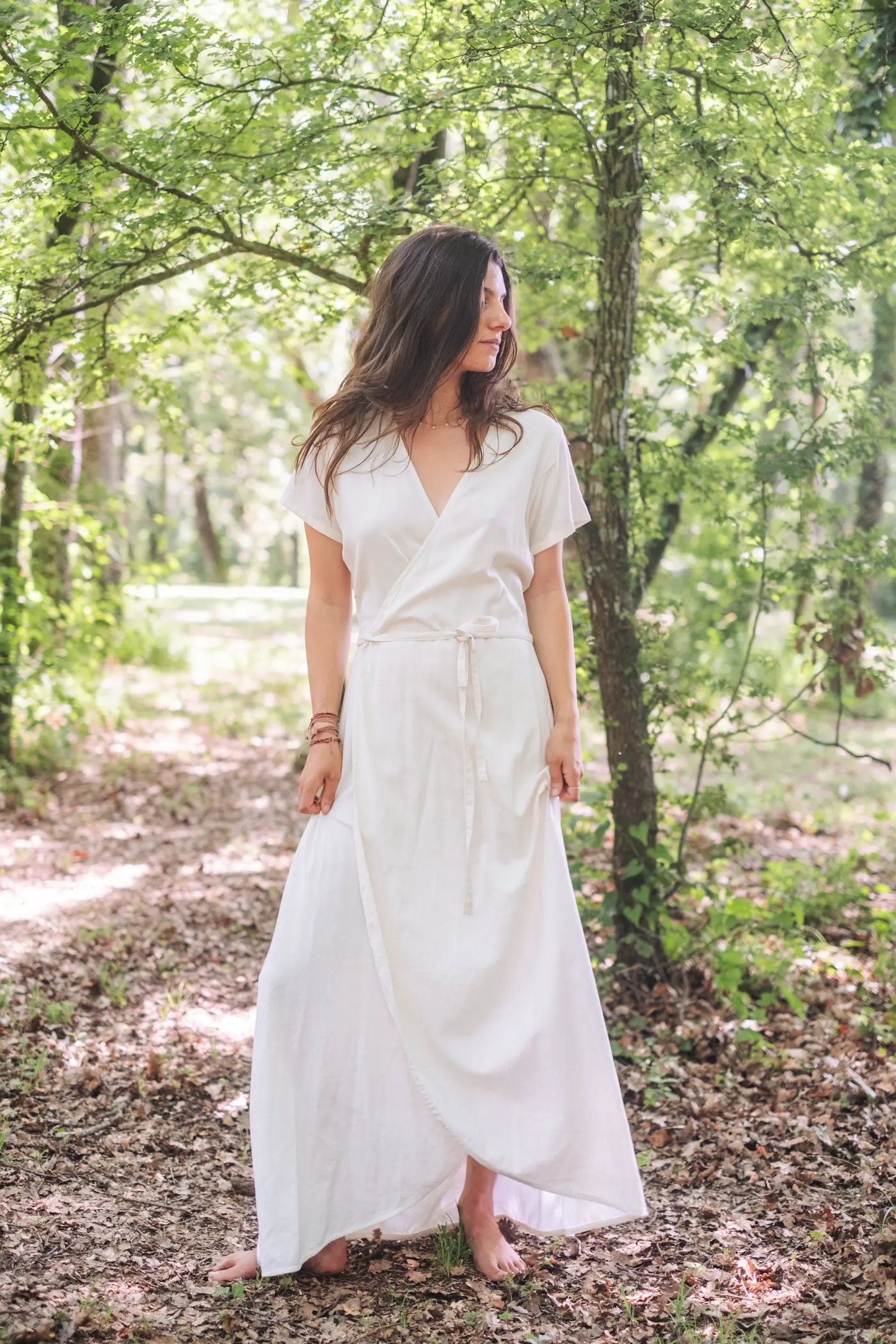 Ana in the forest wearing pieces from the collection